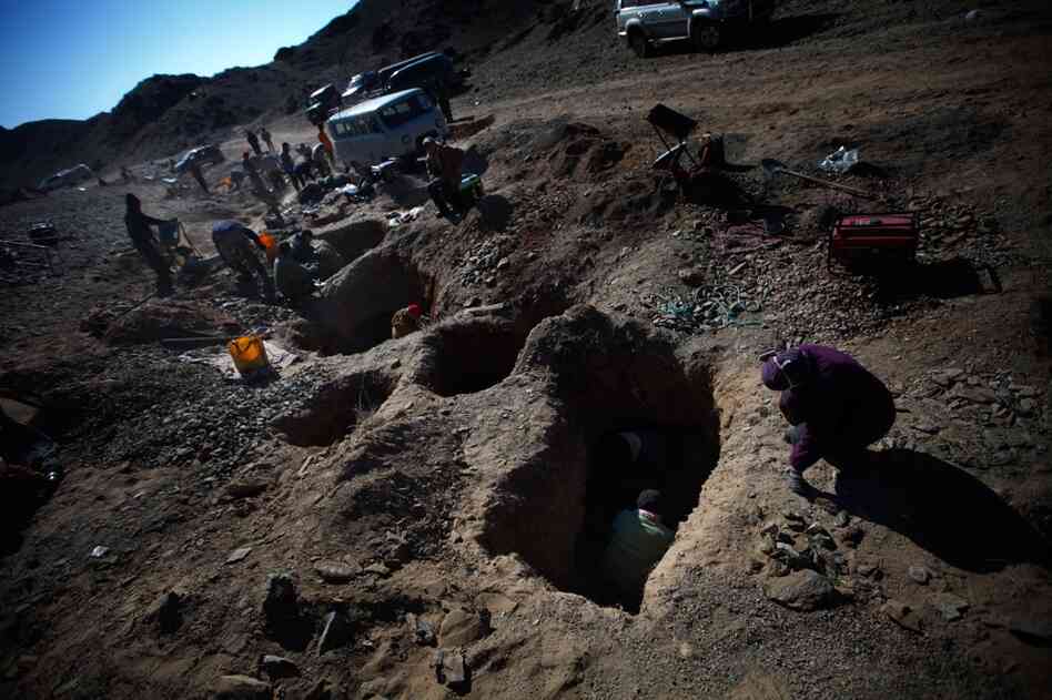 Prospectors typically dig a hole — in this case, 3-to-5-feet deep — to get at the soil. They then sift the soil, using a blower to separate the dust from the gold.