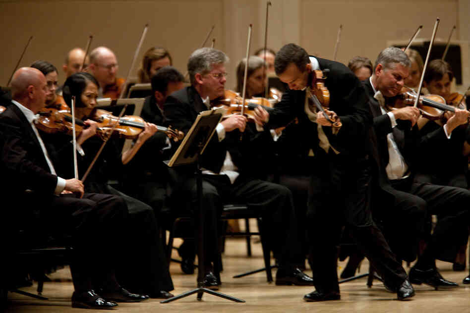 Shaham, a physically intense player, strode about the stage as he played one of his signature pieces. 