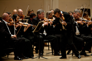 Shaham, a physically intense player, strode about the stage as he played one of his signature pieces.