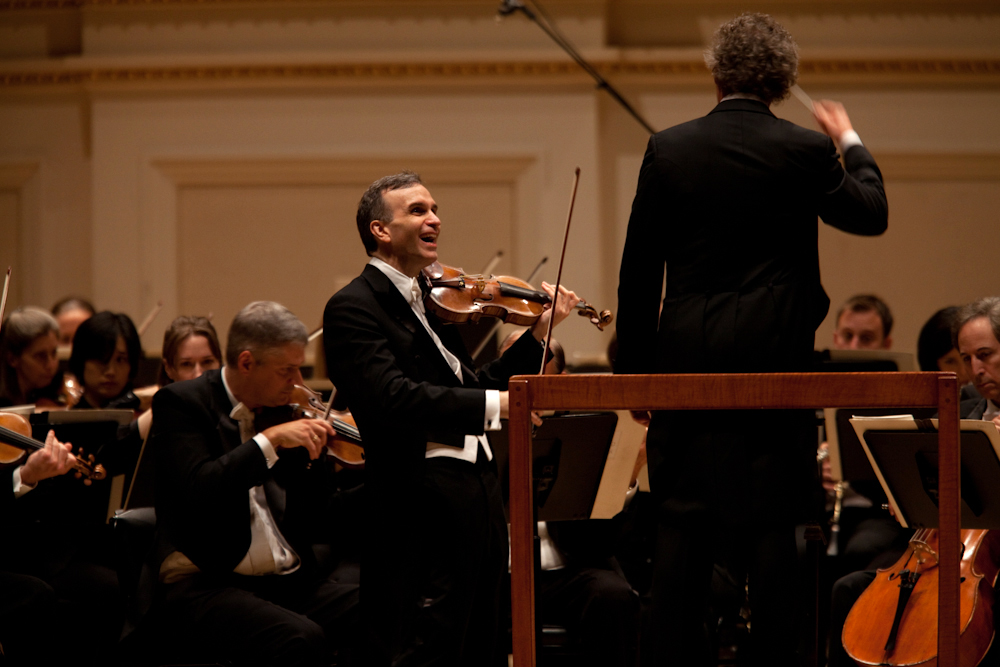 The amiable Shaham often flashed a smile whenever he finished a phrase of the Brahms concerto. 