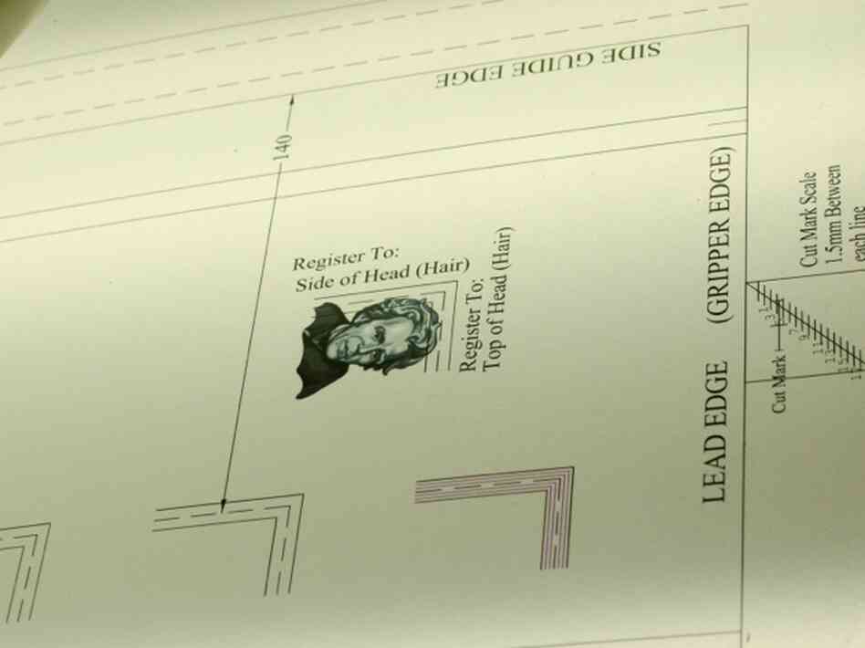 A currency template is used to check that security features, such as a watermark of Andrew Jackson's image, are in the right place.