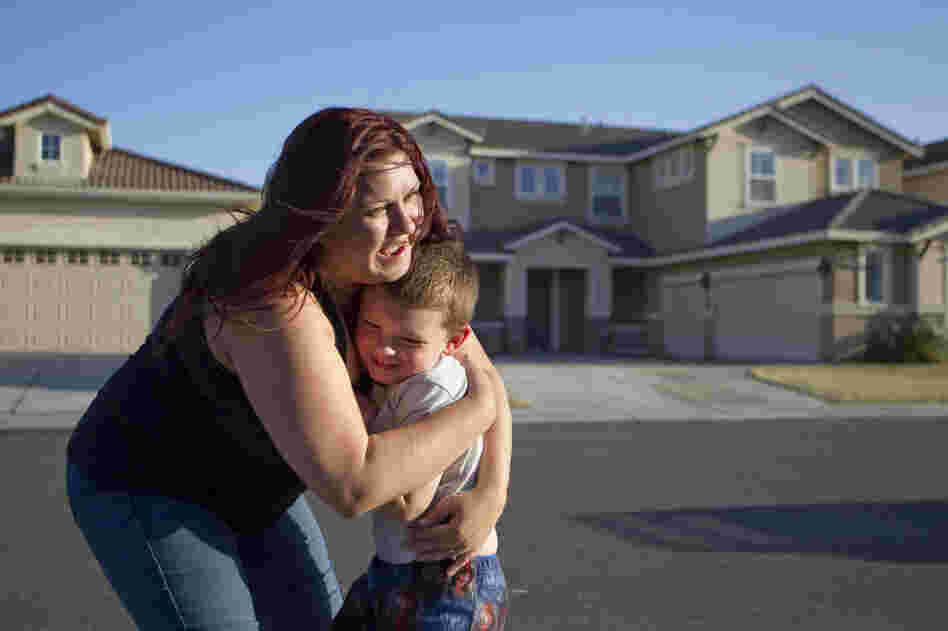 The family tries to find entertainment at home — like letting Jaden play in the sprinklers and walking to a neighborhood park — to save money.