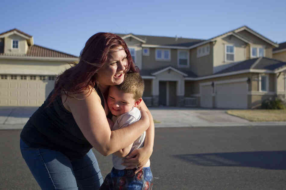 The family tries to find entertainment at home — like letting Jaden play in the sprinklers and walking to a neighborhood park — to save money.