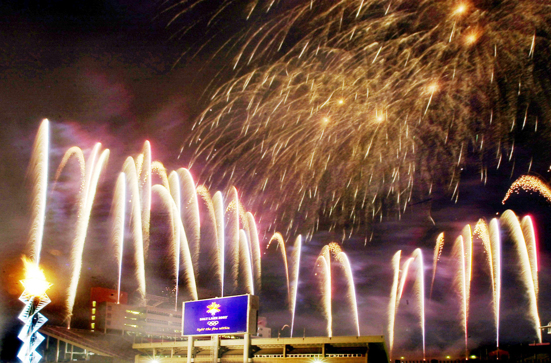 Fireworks fill the sky after the Olympic cauldron was lit on Feb. 8, 2003, marking the one year anniversary of the 2002 Winter Games at the opening and closing ceremony venue in Salt Lake City, the last American city to host the Olympics.