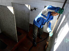 A worker cleans a public bathroom in Beijing. New rules require that public restrooms in the Chinese capital have no more than two flies in them. A worker cleans a public bathroom in Beijing. New rules require that public restrooms in the Chinese capital have no more than two flies in them.