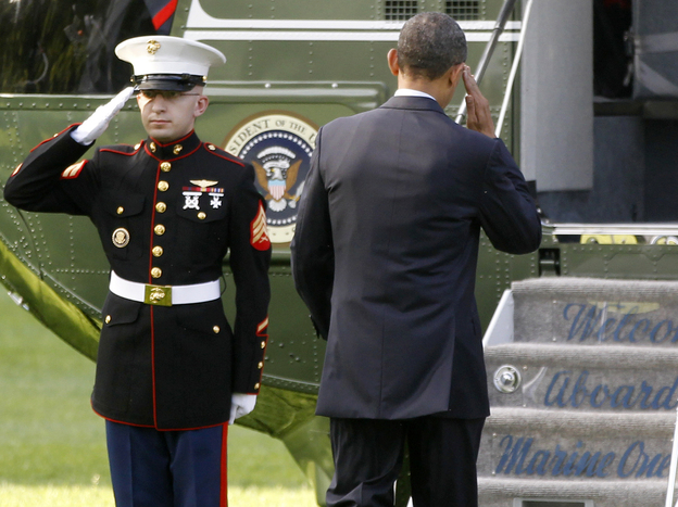 President Obama returns a Marine's salute as he boards the Marine One helicopter Wednesday. Obama traveled to Colorado Springs for the U.S. Air Force Academy graduation ceremony.