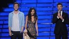 American Idol finalists Phillip Phillips and Jessica Sanchez on stage with host Ryan Seacrest on the Fox TV show Tuesday night. American Idol finalists Phillip Phillips and Jessica Sanchez on stage with host Ryan Seacrest on the Fox TV show Tuesday night.