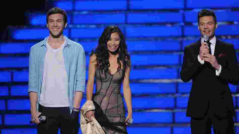 American Idol finalists Phillip Phillips and Jessica Sanchez on stage with host Ryan Seacrest on the Fox TV show Tuesday night.