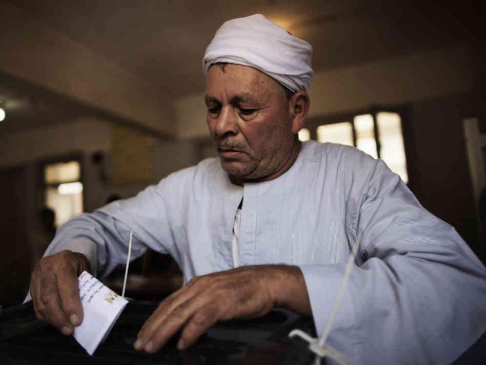 In Cairo, earlier today, a man cast his ballot.