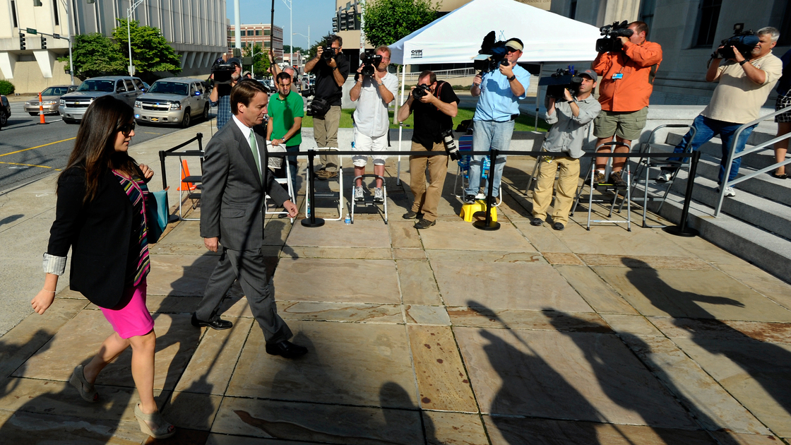 John Edwards arrives with his daughter, Cate Edwards, at U.S. District Court in Greensboro, N.C., on May 17 for closing arguments in his trial. The former Democratic presidential candidate has pleaded not guilty to six counts of campaign finance violations.