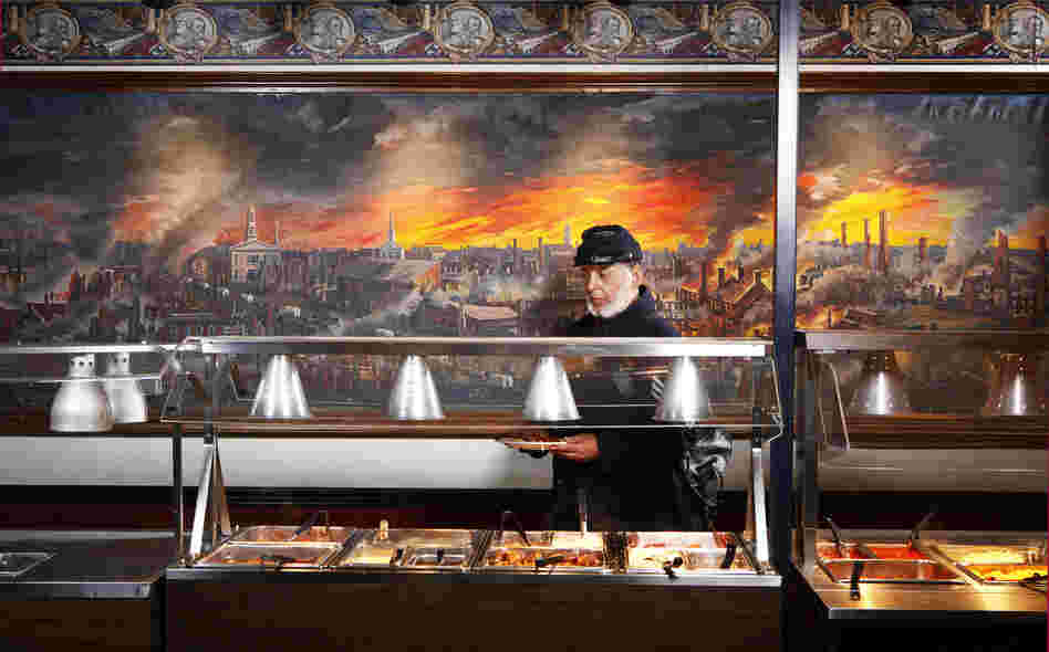 Ben Hawley, 54th Massachusetts, at Pickett's Buffet, Gettysburg, Pa. The 54th Massachusetts infantry, a unit of black Union soldiers, was portrayed in the film Glory. The mural behind Hawley depicts the collapse of the Confederacy.
