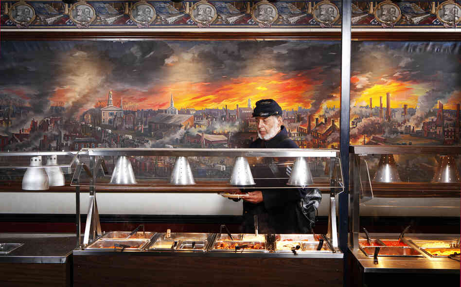 Ben Hawley, 54th Massachusetts, at Pickett's Buffet, Gettysburg, Pa. The 54th Massachusetts infantry, a unit of black Union soldiers, was portrayed in the film Glory. The mural behind Hawley depicts the collapse of the Confederacy.