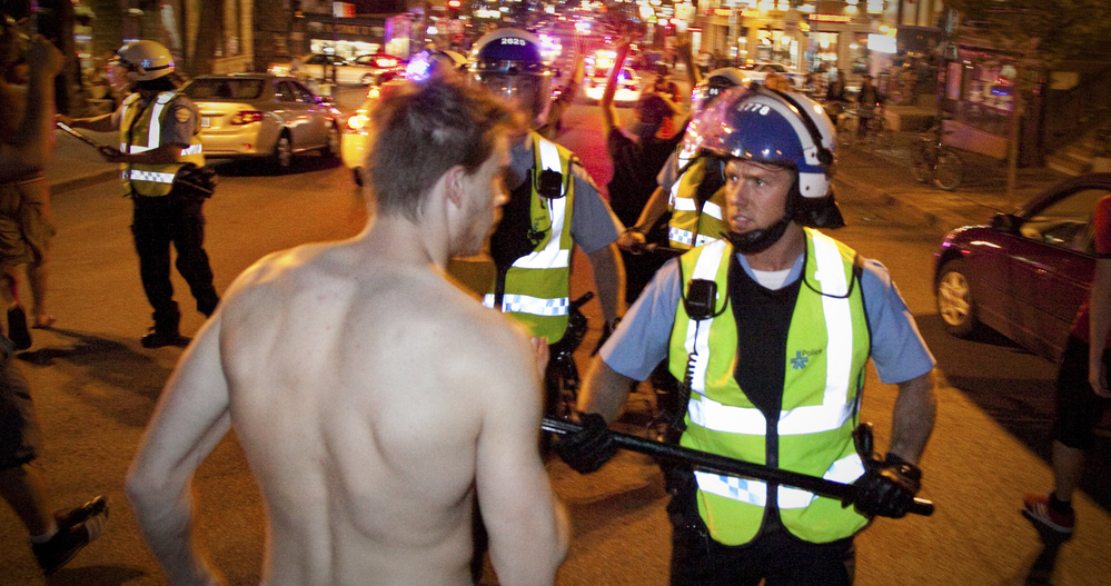 Montreal police and protesters face off on Wednesday during a demonstration against student tuition hikes.