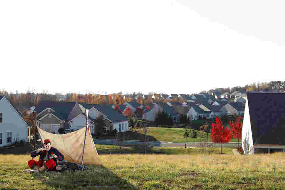 Federal Zouave Prillaman brushes his teeth where there was once a winter encampment of the Army of the Potomac, in Stafford County, Va. Several Union Zouave regiments, which wore colorful, French North African-influenced uniforms, camped here.