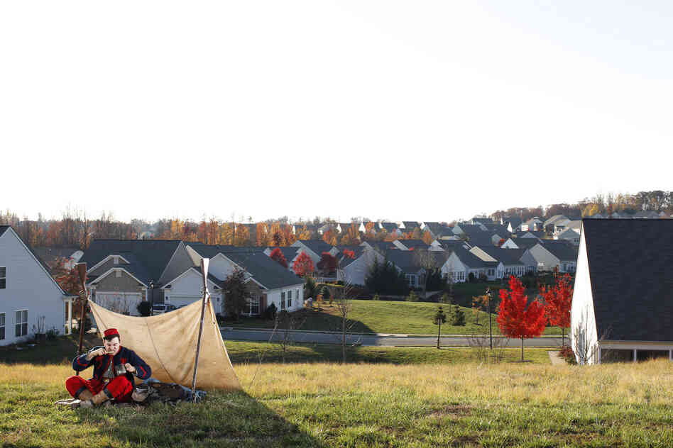 Federal Zouave Prillaman brushes his teeth where there was once a winter encampment of the Army of the Potomac, in Stafford County, Va. Several Union Zouave regiments, which wore colorful, French North African-influenced uniforms, camped here.