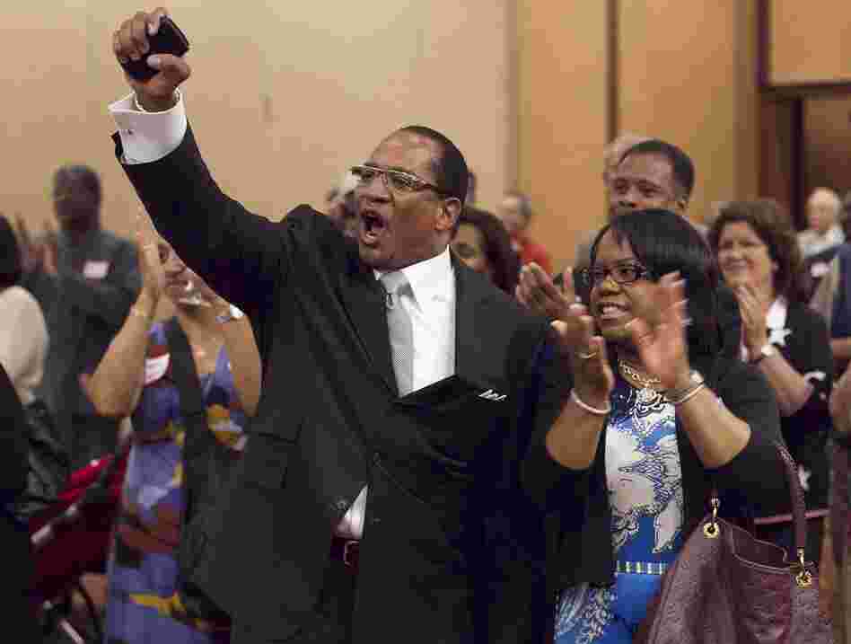 Dr. Patrick Wooden, senior pastor of the Upper Room Church of God In Christ in North Carolina, celebrates early returns that show strong support for Amendment One, which bans gay marriage in the state.