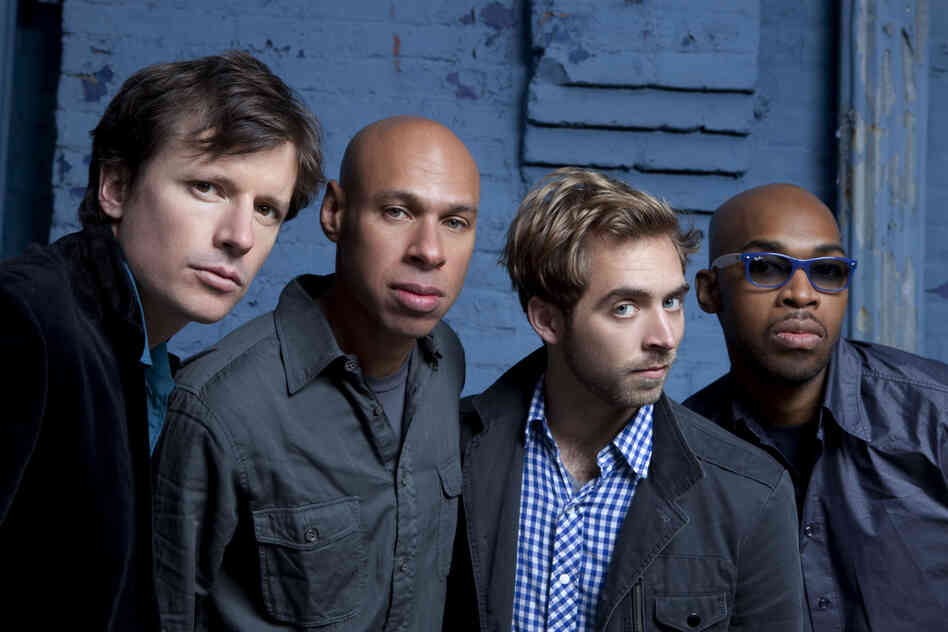 In this promotional image of the band James Farm, Joshua Redman is second from left, and Aaron Parks is to his left.