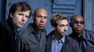In this promotional image of the band James Farm, Joshua Redman is second from left, and Aaron Parks is to his left. In this promotional image of the band James Farm, Joshua Redman is second from left, and Aaron Parks is to his left.