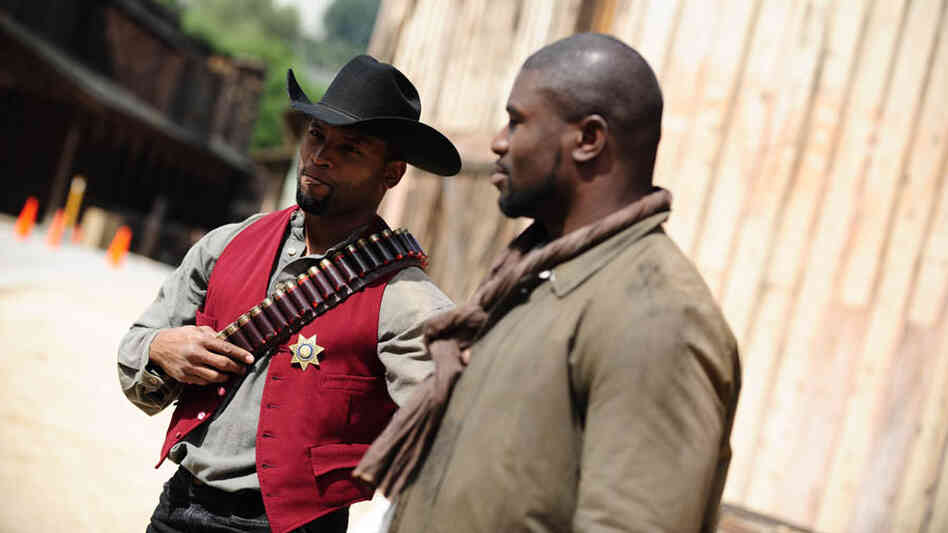 At the 2012 Pro Hollywood Boot Camp in Los Angeles, former Green Bay Packers running back Ahman Green (left) and free agent fullback Ovie Mughelli hang out on the back lot at Universal Studios. At the 2012 Pro Hollywood Boot Camp in Los Angeles, former Green Bay Packers running back Ahman Green (left) and free agent fullback Ovie Mughelli hang out on the back lot at Universal Studios.