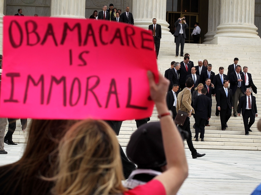 Attorneys general leave the U.S. Supreme Court on March 28, the last of three days of oral arguments on the health care law.