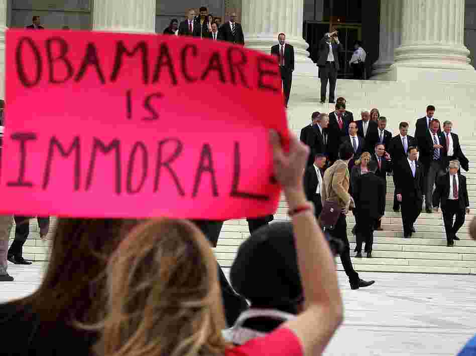 Attorneys general leave the U.S. Supreme Court on March 28, the last of three days of oral arguments on the health care law.