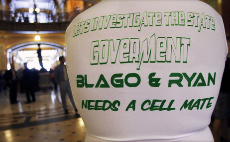 Despite the misspelling and grammar error, the tee-shirt message is clear on a protester at the Illinois capitol on May 16, 2012. It cites two former governors now in federal prison for corruption. Despite the misspelling and grammar error, the tee-shirt message is clear on a protester at the Illinois capitol on May 16, 2012. It cites two former governors now in federal prison for corruption.