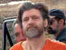 Unabomber Ted Kaczynski being led into a Montana court in 1996.
