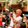 Bill Koch (center) celebrates his team's 1992 America's Cup win. Koch, the brother of billionaire GOP donors Charles and David, has given $2 million to the superPAC backing Mitt Romney. Bill Koch (center) celebrates his team's 1992 America's Cup win. Koch, the brother of billionaire GOP donors Charles and David, has given $2 million to the superPAC backing Mitt Romney.