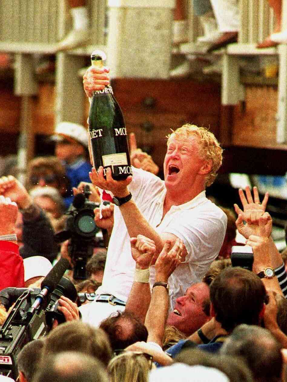 Bill Koch (center) celebrates his team's 1992 America's Cup win. Koch, the brother of billionaire GOP donors Charles and David, has given $2 million to the superPAC backing Mitt Romney.