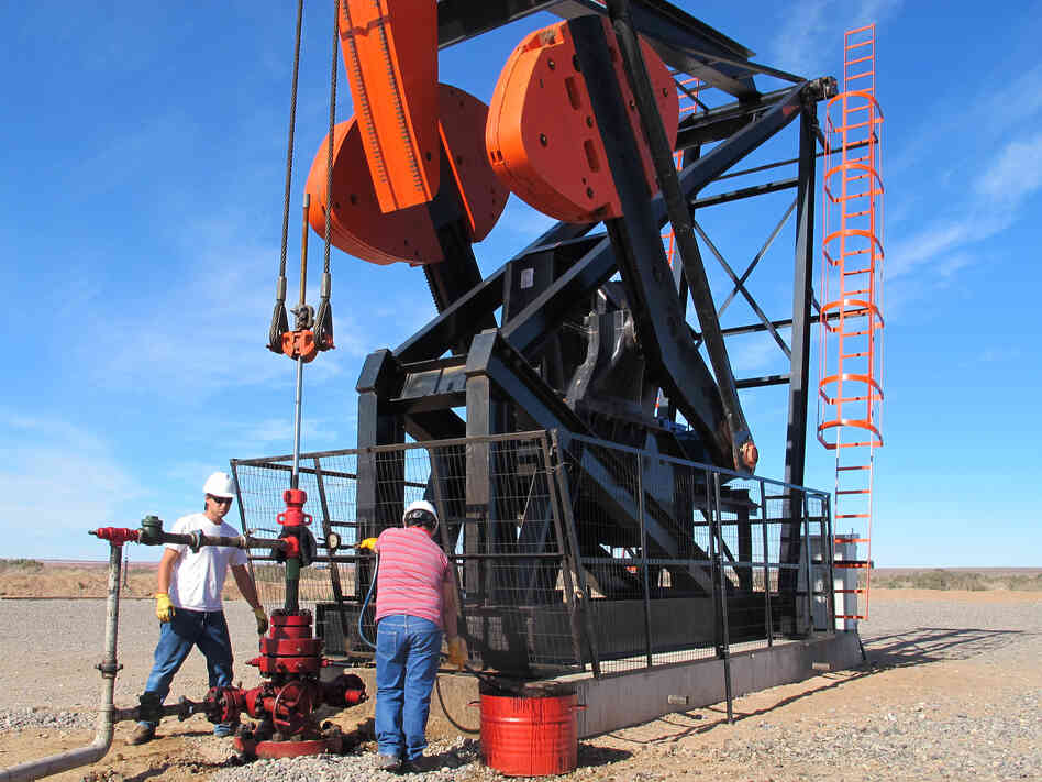 Like countries throughout the Americas, Argentina is feverishly drilling for oil and gas. Workers are shown here at a derrick in the desert in southern Argentina.