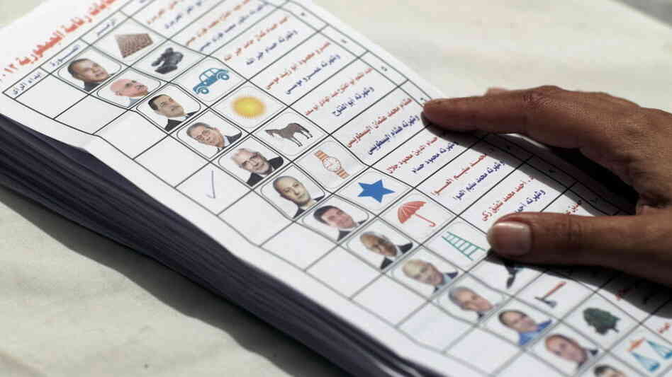 An Egyptian election official counting ballots from the presidential election.