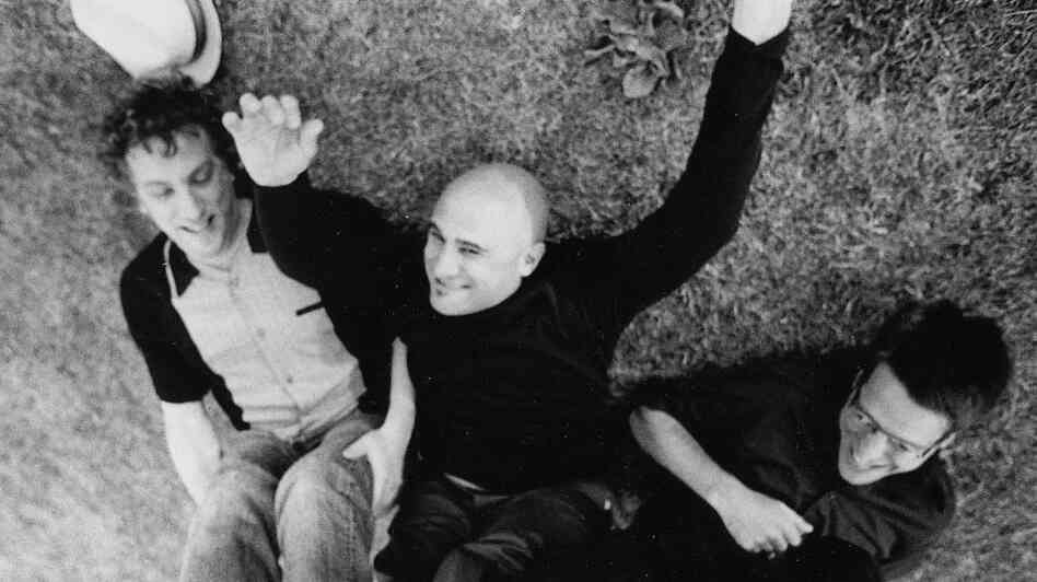 Twelve years after uploading his band's songs on MP3.com, Jim's Big Ego lead singer Jim Infantino (center) still thinks digital music is "pretty neat." Twelve years after uploading his band's songs on MP3.com, Jim's Big Ego lead singer Jim Infantino (center) still thinks digital music is "pretty neat."