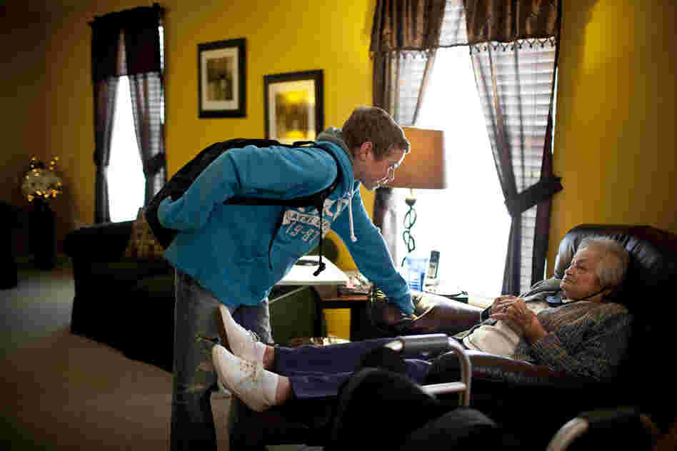 Chris Martin, 14, greets his great-grandmother AnnaBelle Bowers, 87, who lives part time with the Martin family in Harrisburg, Pa. Occasionally, Chris stays at home to watch "Snootzie," as the family affectionately calls her, when his parents are busy.