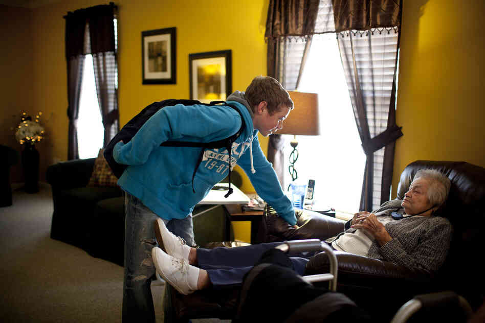 Chris Martin, 14, greets his great-grandmother AnnaBelle Bowers, 87, who lives part time with the Martin family in Harrisburg, Pa. Occasionally, Chris stays at home to watch "Snootzie," as the family affectionately calls her, when his parents are busy.