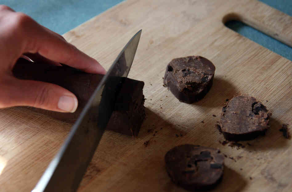 The refrigerated logs of dough are sliced into half-inch rounds. The cookies can be sprinkled with salt before baking. The refrigerated logs of dough are sliced into half-inch rounds. The cookies can be sprinkled with salt before baking.