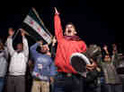 Syrians chant slogans during an anti-regime protest in Qusayr.