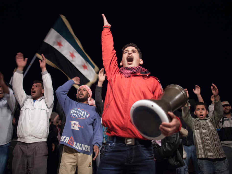 Syrians chant slogans during an anti-regime protest in Qusayr. Syrians chant slogans during an anti-regime protest in Qusayr.