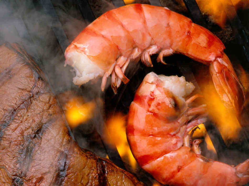 Food science guy Alton Brown says the last thing you want to see is flames touching food on the grill.