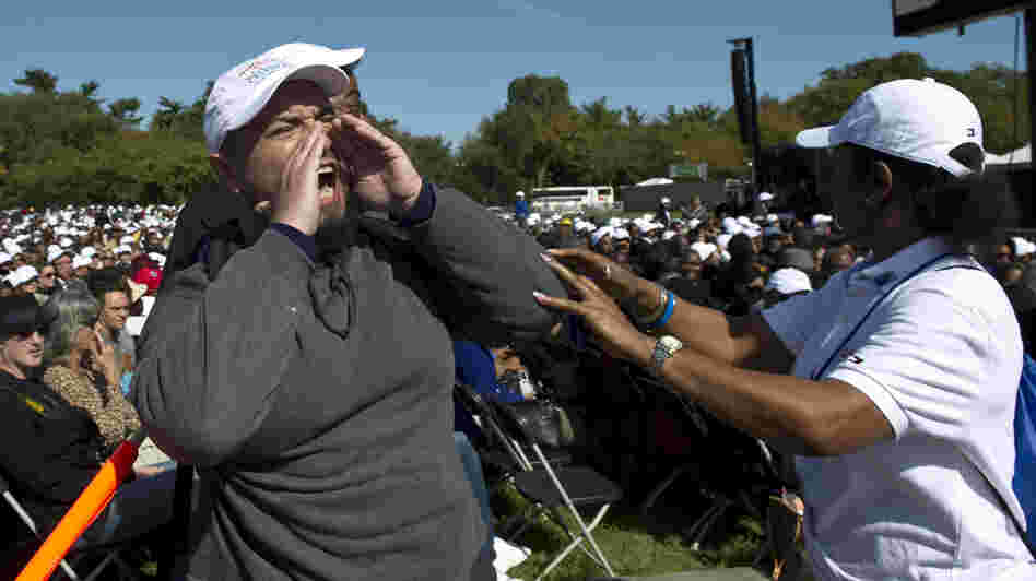 An unidentified heckler lets loose as President Obama begins a speech at the Martin Luther King memorial dedication in Washington, D.C., in October 2011.