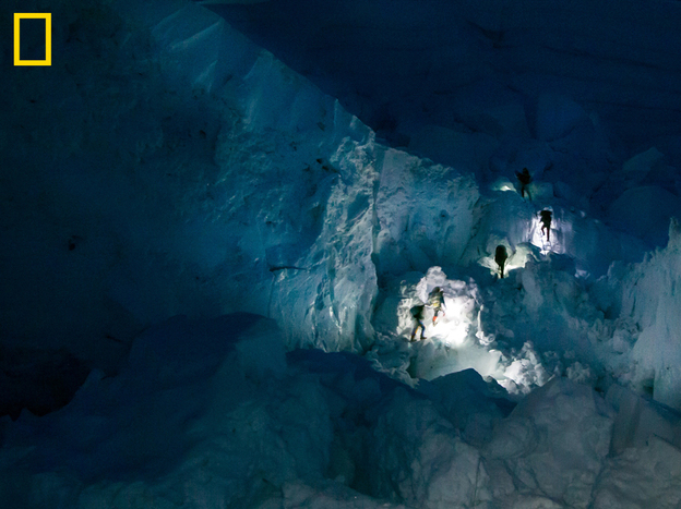 Sherpas' headlamps in the Khumbu Icefall early in the morning. You can see more at: http://ngm.nationalgeographic.com/everest/blog.