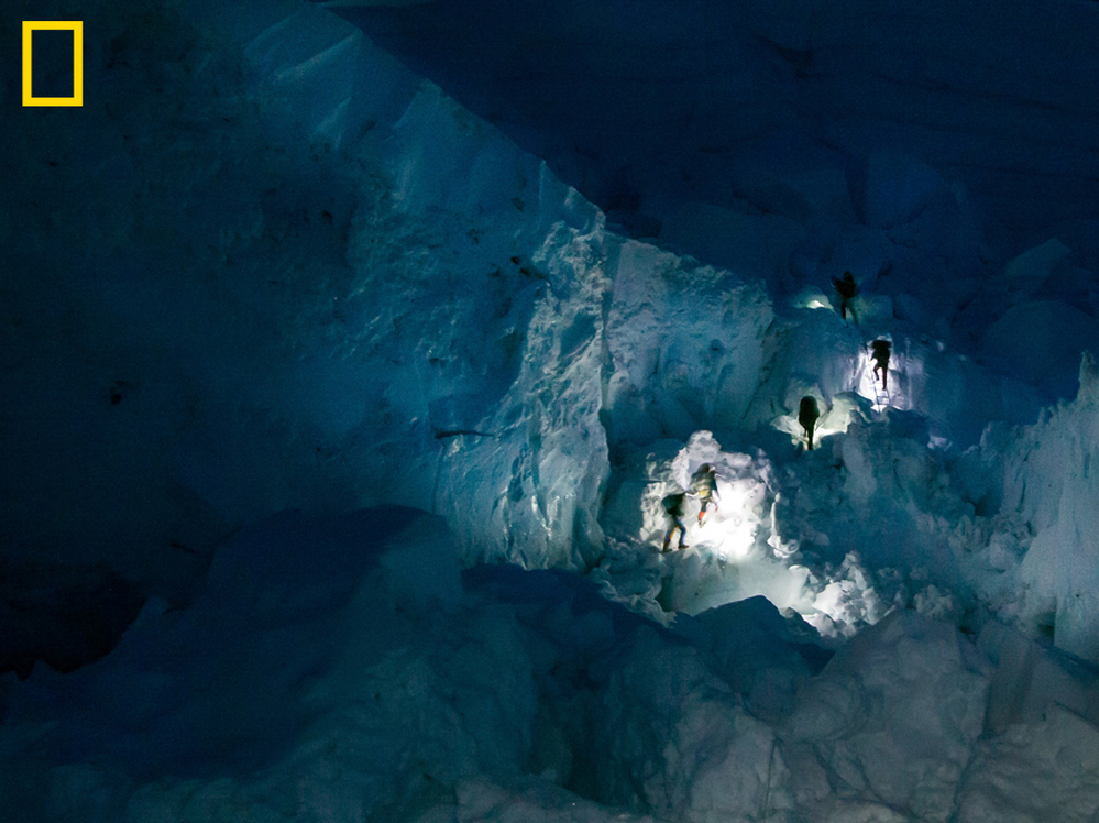 Sherpas' headlamps in the Khumbu Icefall early in the morning. You can see more at: http://ngm.nationalgeographic.com/everest/blog.