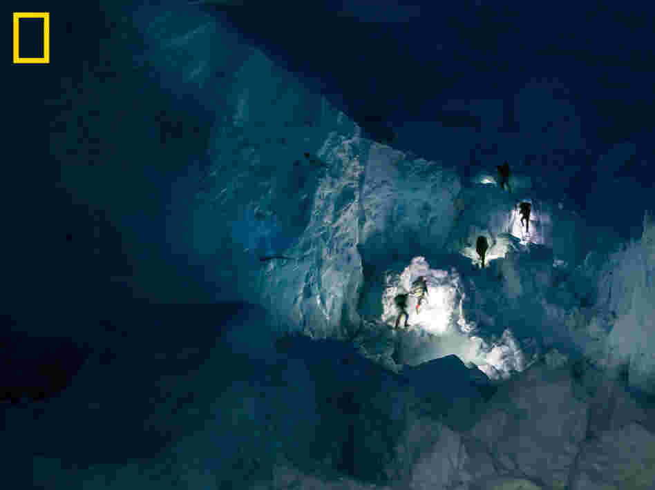 Sherpas' headlamps in the Khumbu Icefall early in the morning. You can see more at: http://ngm.nationalgeographic.com/everest/blog.