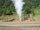 A local resident entertains visitors to the Kawah Kamojang geothermal field in West Java. He puts a length of bamboo to the steam coming from the ground to make a whistle, then throws soda cans into the vent, which shoots them high into the air. The Dutch colonial government drilled Indonesia's first geothermal wells at Kamojang in 1926, when the country was still known as the Dutch East Indies. A local resident entertains visitors to the Kawah Kamojang geothermal field in West Java. He puts a length of bamboo to the steam coming from the ground to make a whistle, then throws soda cans into the vent, which shoots them high into the air. The Dutch colonial government drilled Indonesia's first geothermal wells at Kamojang in 1926, when the country was still known as the Dutch East Indies.