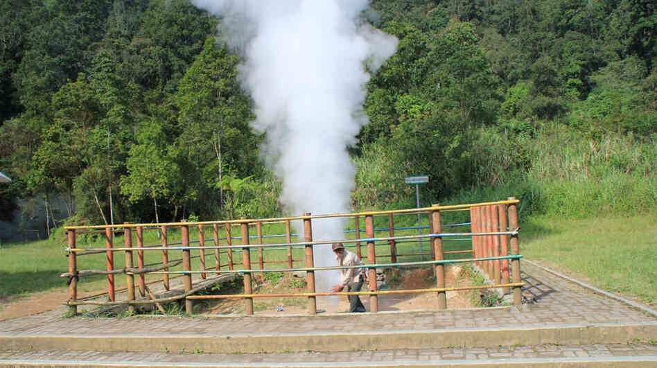 A local resident entertains visitors to the Kawah Kamojang geothermal field in West Java. He puts a length of bamboo to the steam coming from the ground to make a whistle, then throws soda cans into the vent, which shoots them high into the air. The Dutch colonial government drilled Indonesia's first geothermal wells at Kamojang in 1926, when the country was still known as the Dutch East Indies.