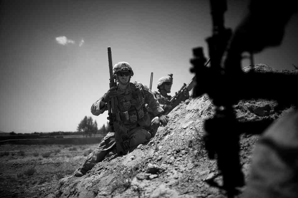 Sgt. Kyle Gonzales prepares to reposition himself during a battle near the village of Babaker.