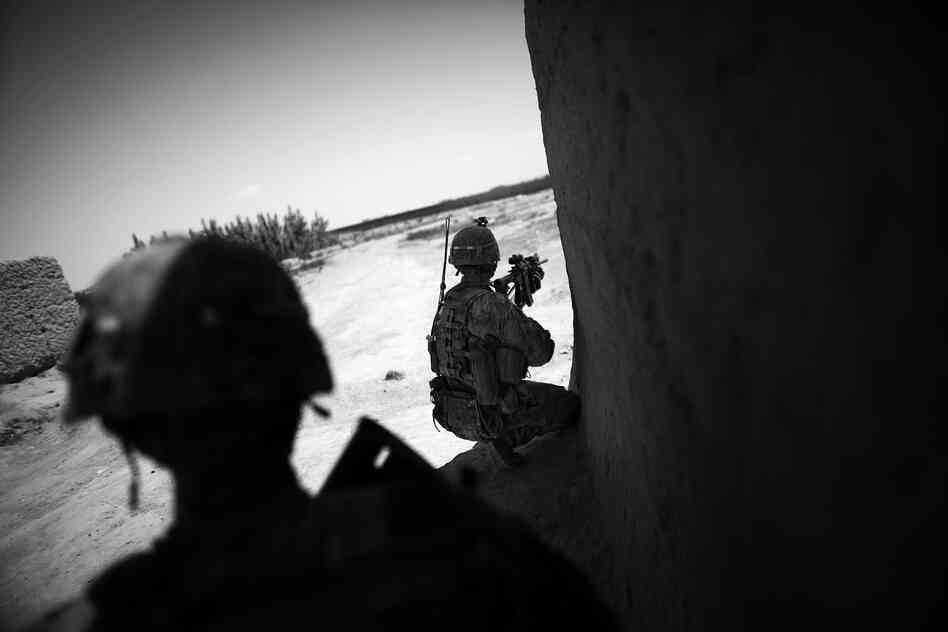 Soldiers try to spot the location of insurgents firing at them in Babaker. 