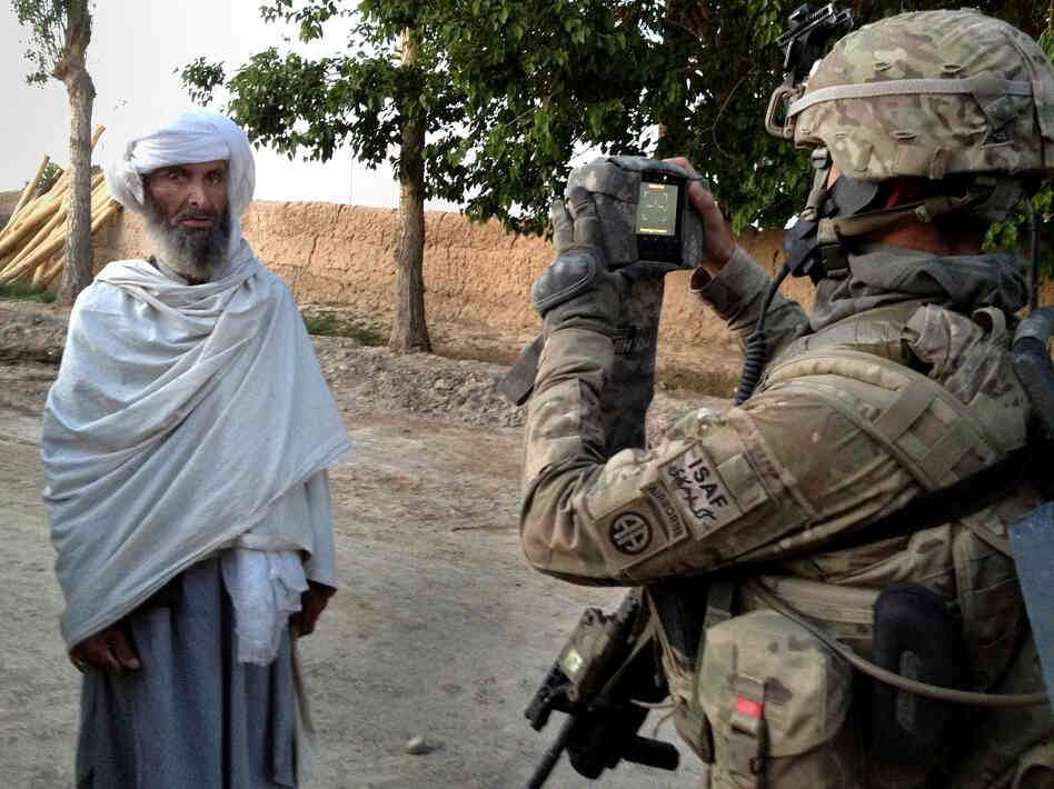 U.S. soldiers arrive early in the morning in the eastern village of Bagi Kheyl in an effort to surprise any potential Taliban. They walk through the village, taking down residents' information and searching for signs of the Taliban.