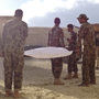 The body of Afghan soldier Burhan Muddin is carried to an ambulance in eastern Afghanistan's Ghazni province. He was shot while on guard duty at an Afghan army outpost near the U.S. base. He was brought to the Americans for medical treatment, but U.S. forces were unable to save him.