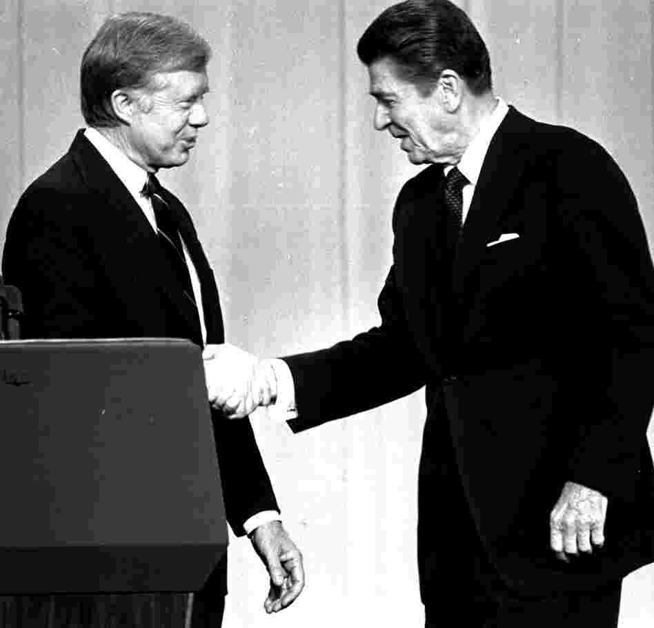 President Jimmy Carter shakes hands with Republican challenger Ronald Reagan before a debate in Cleveland in October 1980.