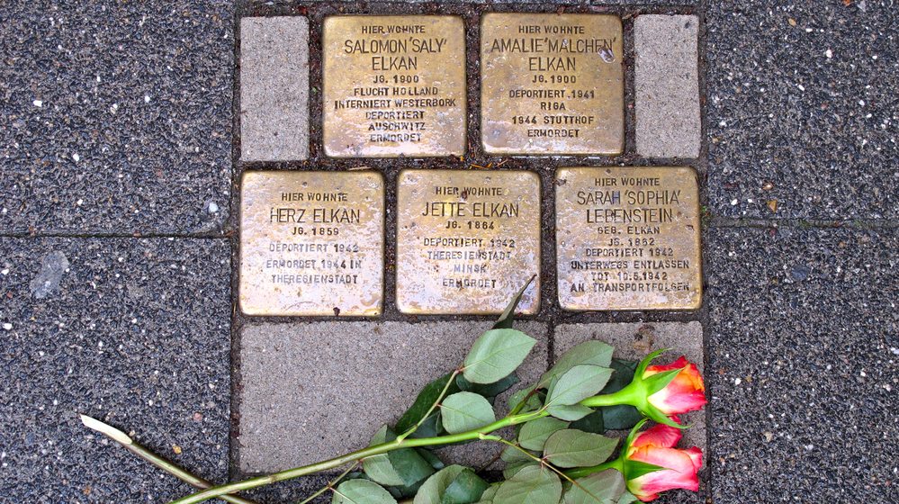 Brass bricks known as Stolperstein, or "stumbling stones," in front of a home in Raesfeld, Germany, where five members of a single family were forcibly removed by the Nazis. Across Germany, the stones commemorate the millions of victims of the Nazi regime.